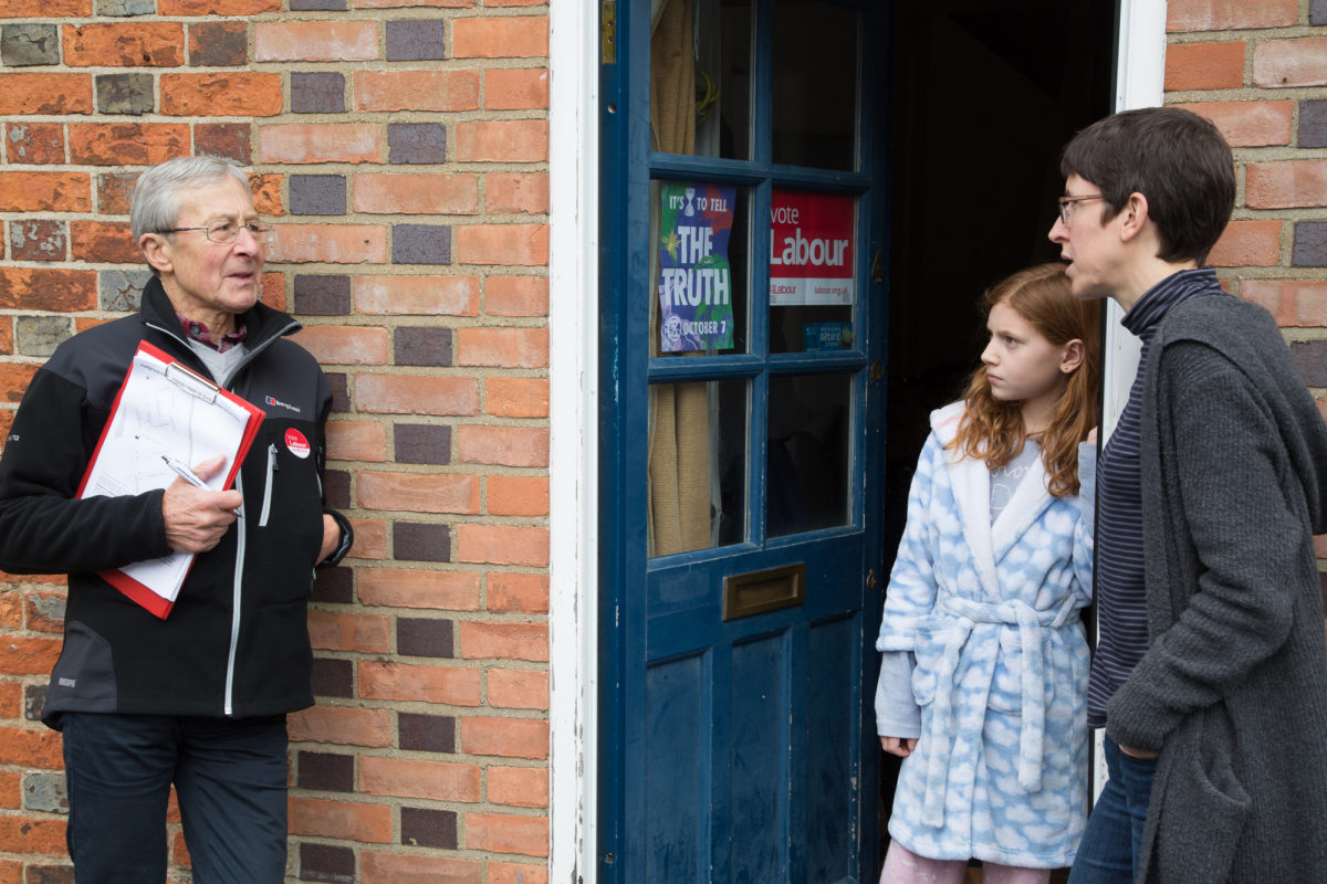 A Labour activist talking to voters at election time